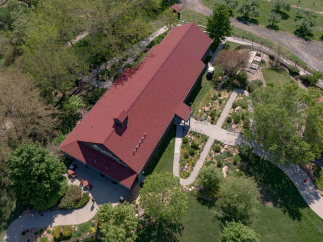 Arbor Day Farms building from above with trees and paths