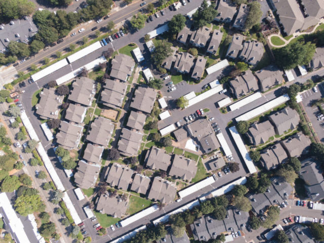 A photo of roofs from above of a housing community