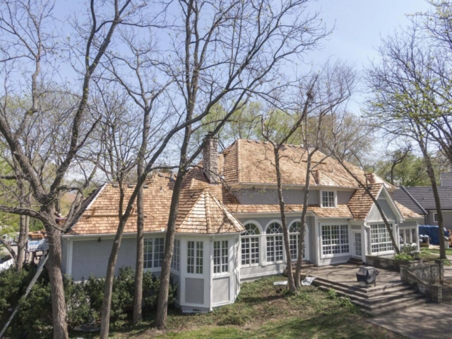 A historical house in Nebraska with it's roof recently re-shingled.